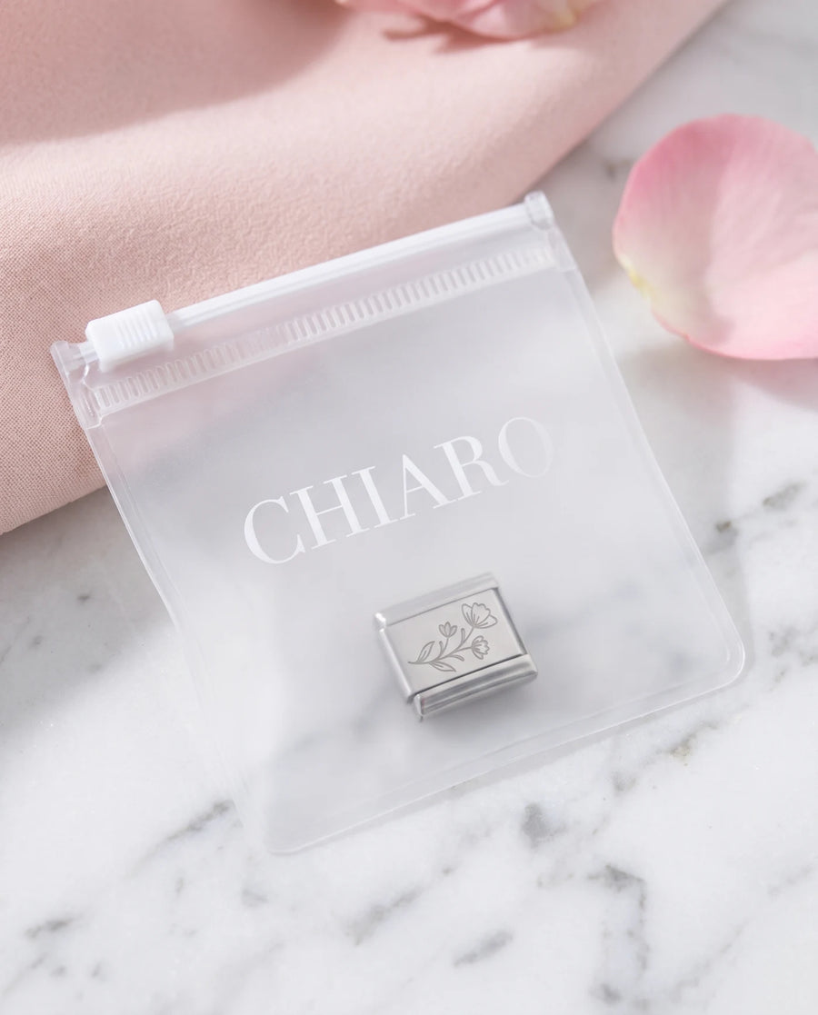 Custom laser-engraved Italian charm in a CHIARO pouch, ready to wear