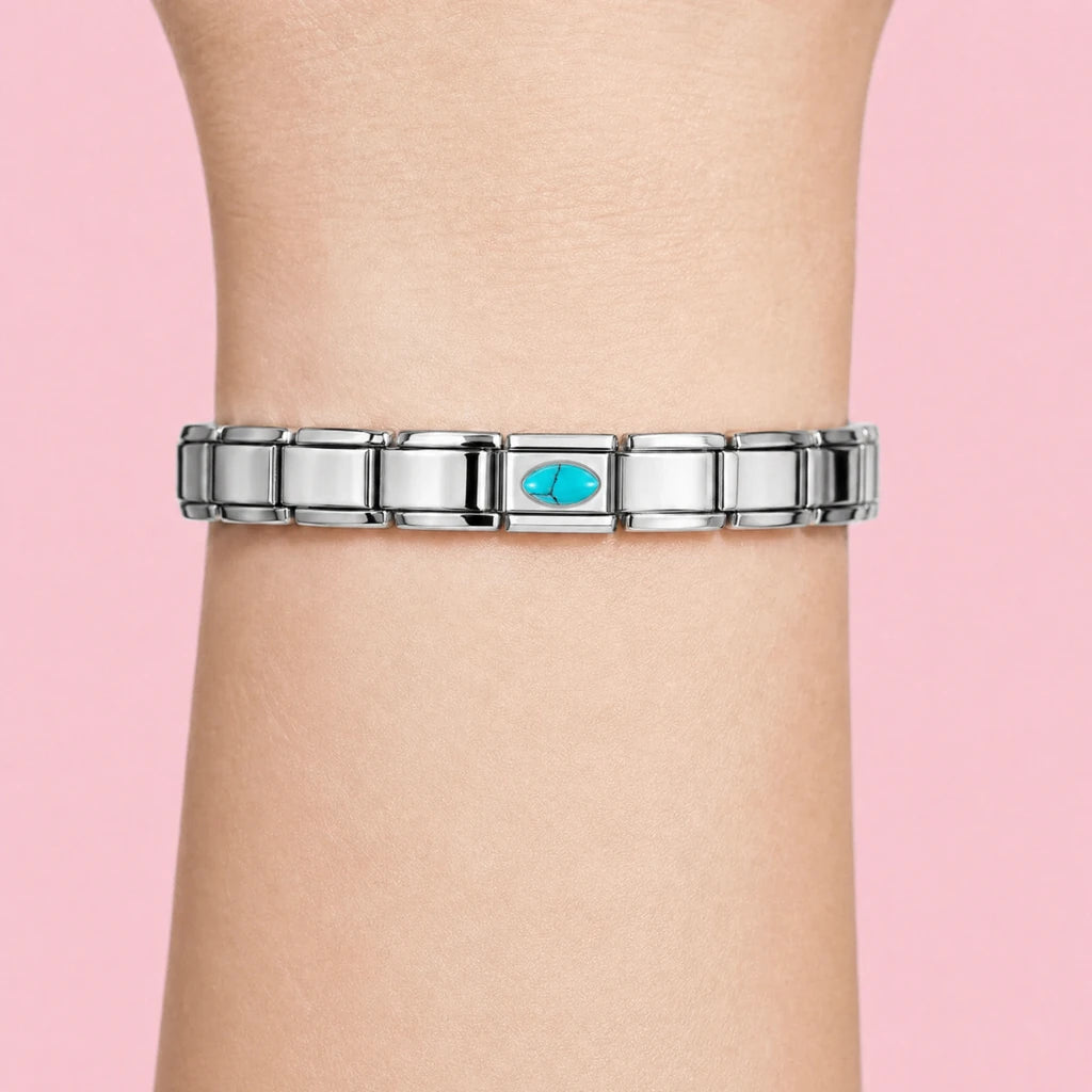 Turquoise Stone charm worn on a silver Italian bracelet