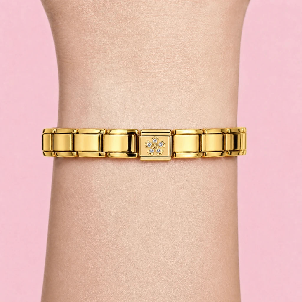 Crystal Bloom charm worn on a gold Italian bracelet
