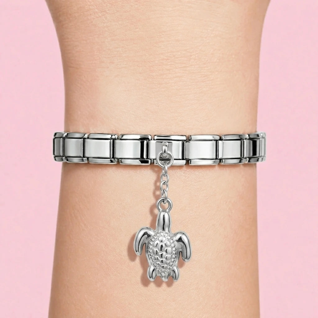 Sea turtle dangle charm worn on a silver Italian bracelet