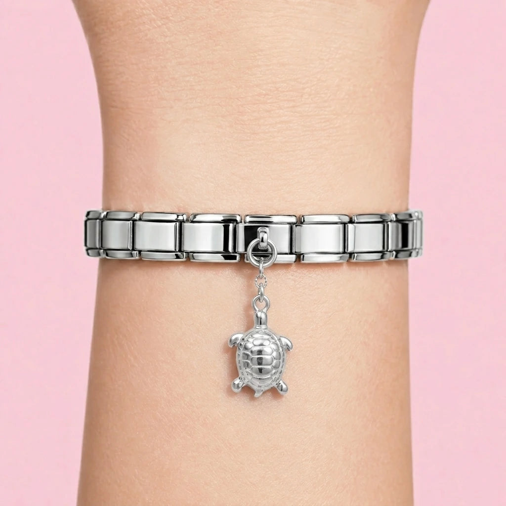 Turtle dangle charm worn on a silver Italian bracelet