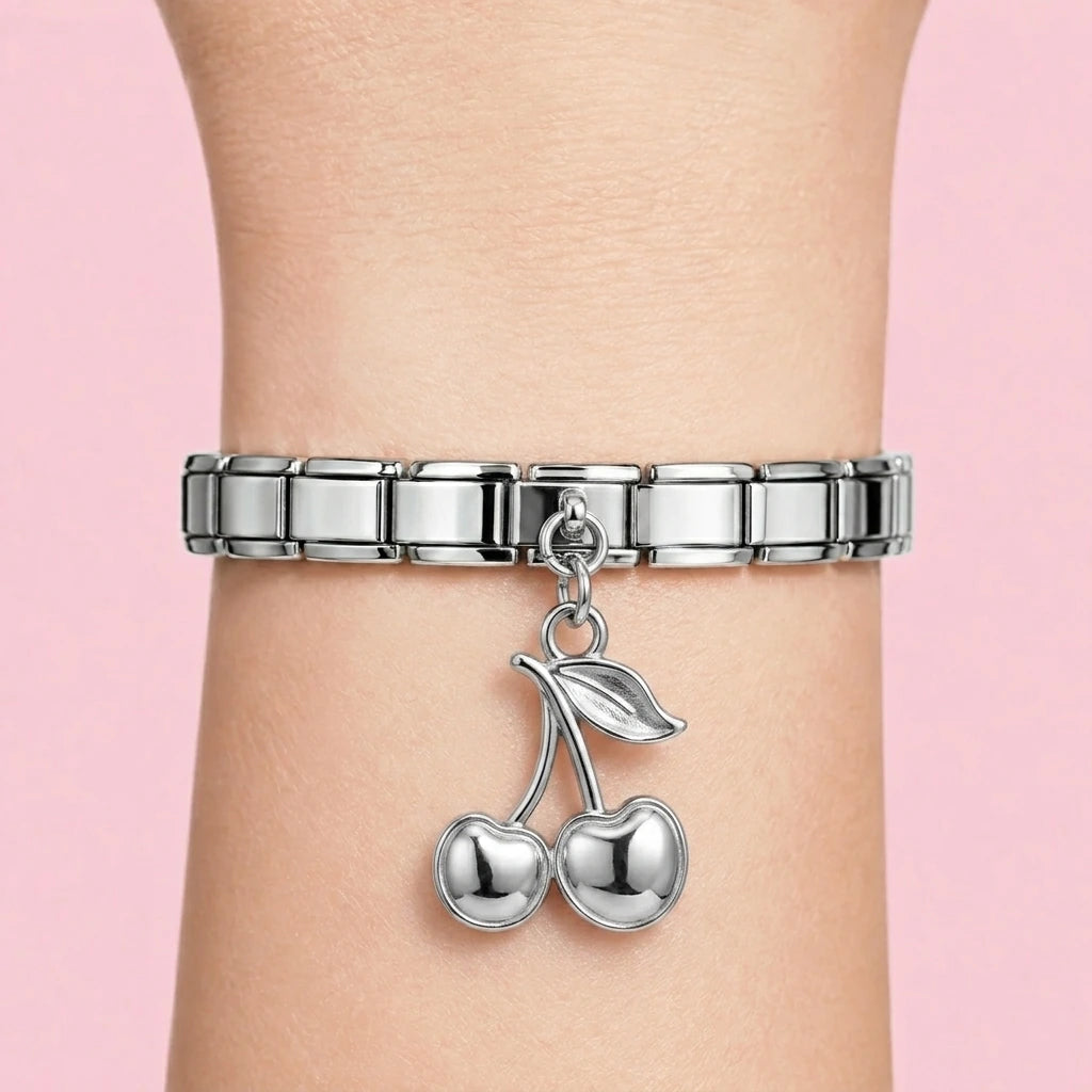 Cherry dangle charm worn on a silver Italian bracelet