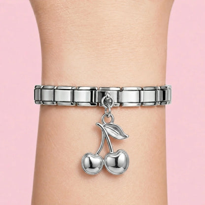Cherry dangle charm worn on a silver Italian bracelet