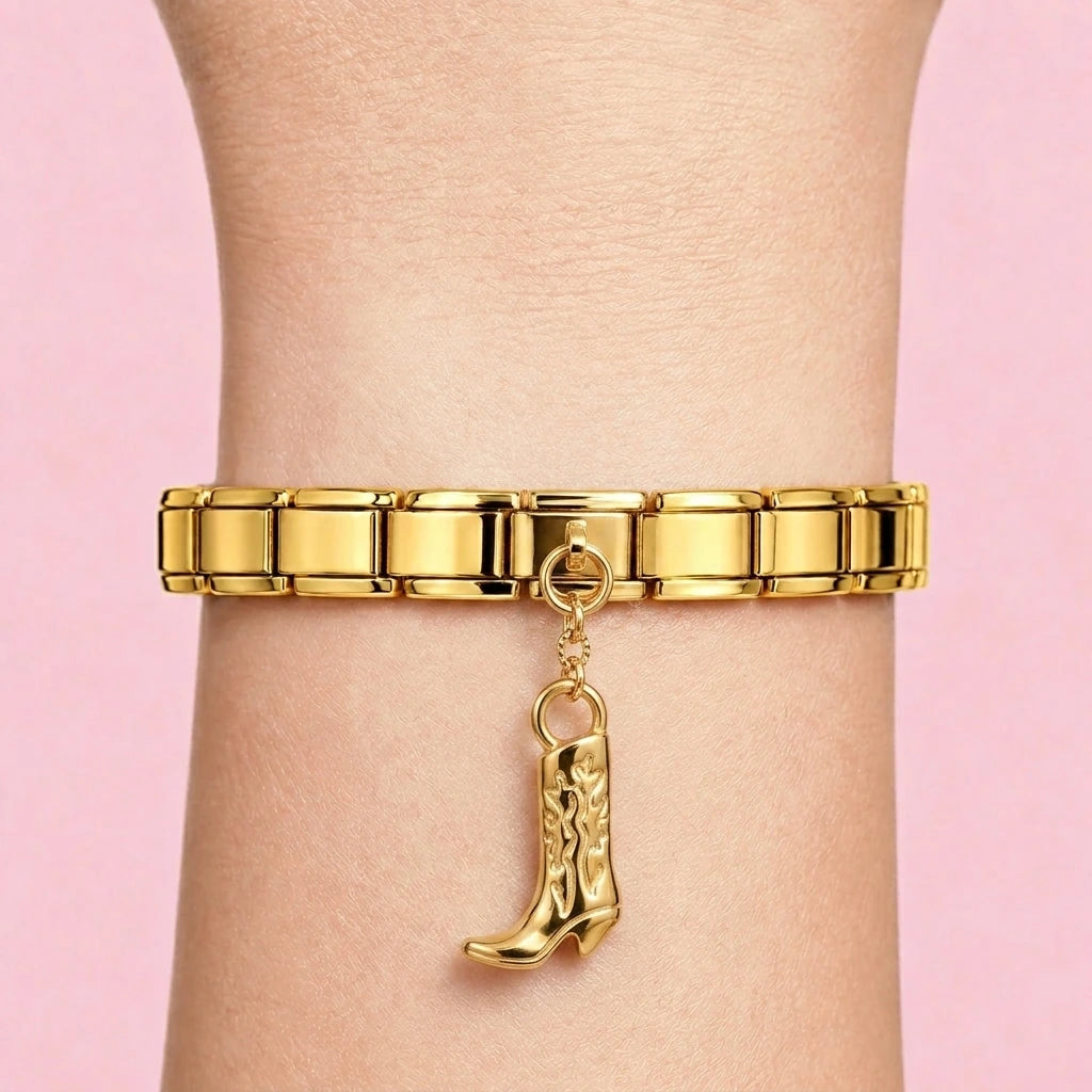 Cowboy boot dangle charm worn on a gold Italian bracelet