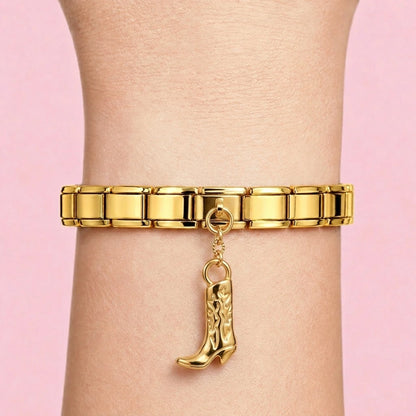 Cowboy boot dangle charm worn on a gold Italian bracelet