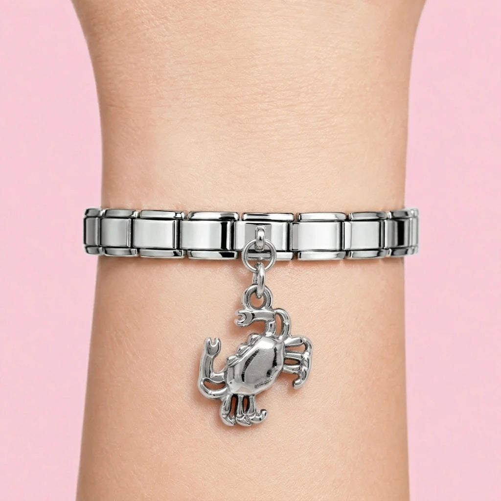 Crab dangle charm worn on a silver Italian bracelet