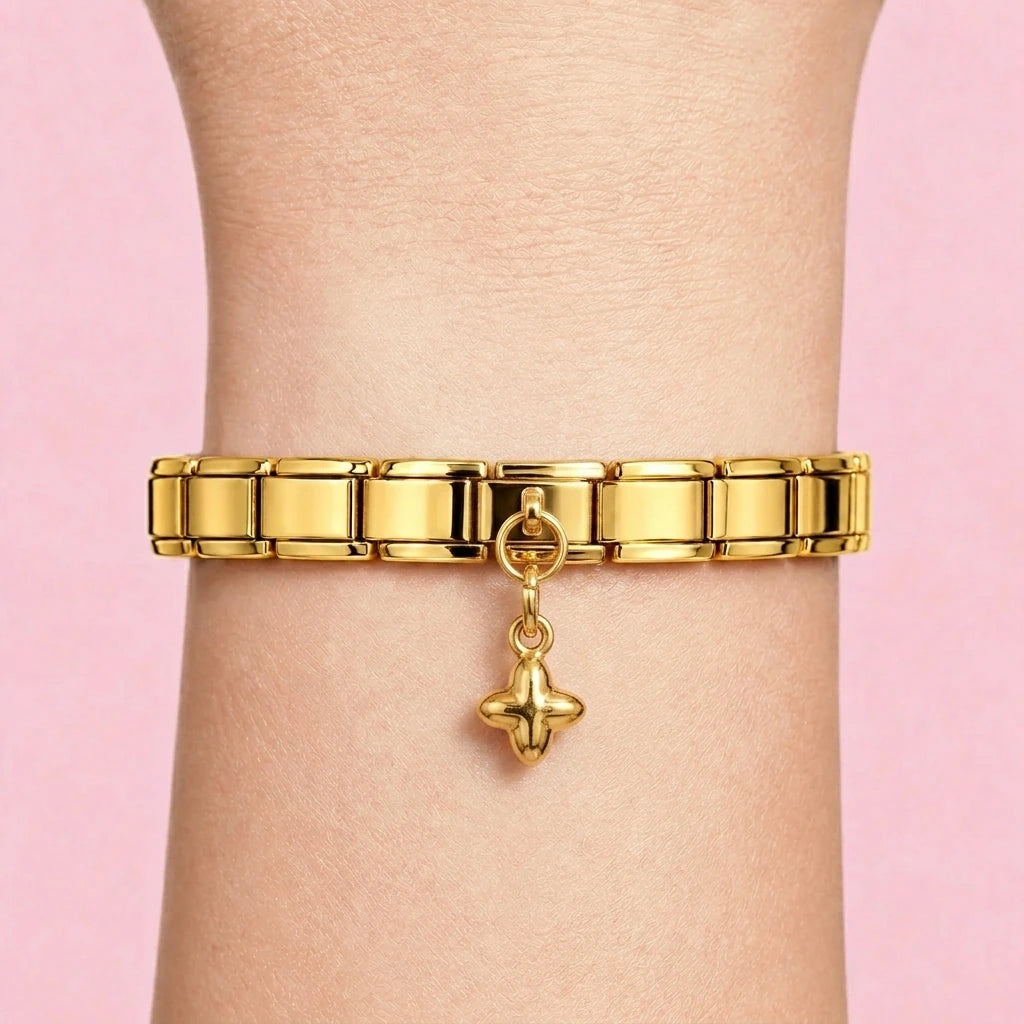 Cross dangle charm worn on a gold Italian bracelet