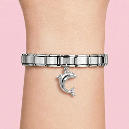 Dolphin dangle charm worn on a silver Italian bracelet