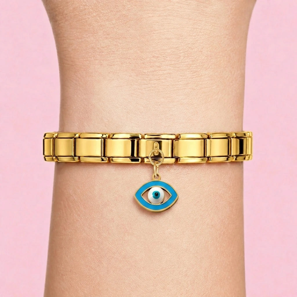 Evil eye dangle charm worn on a gold Italian bracelet