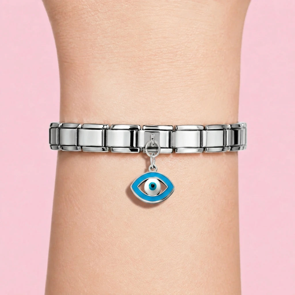 Evil eye dangle charm worn on a silver Italian bracelet