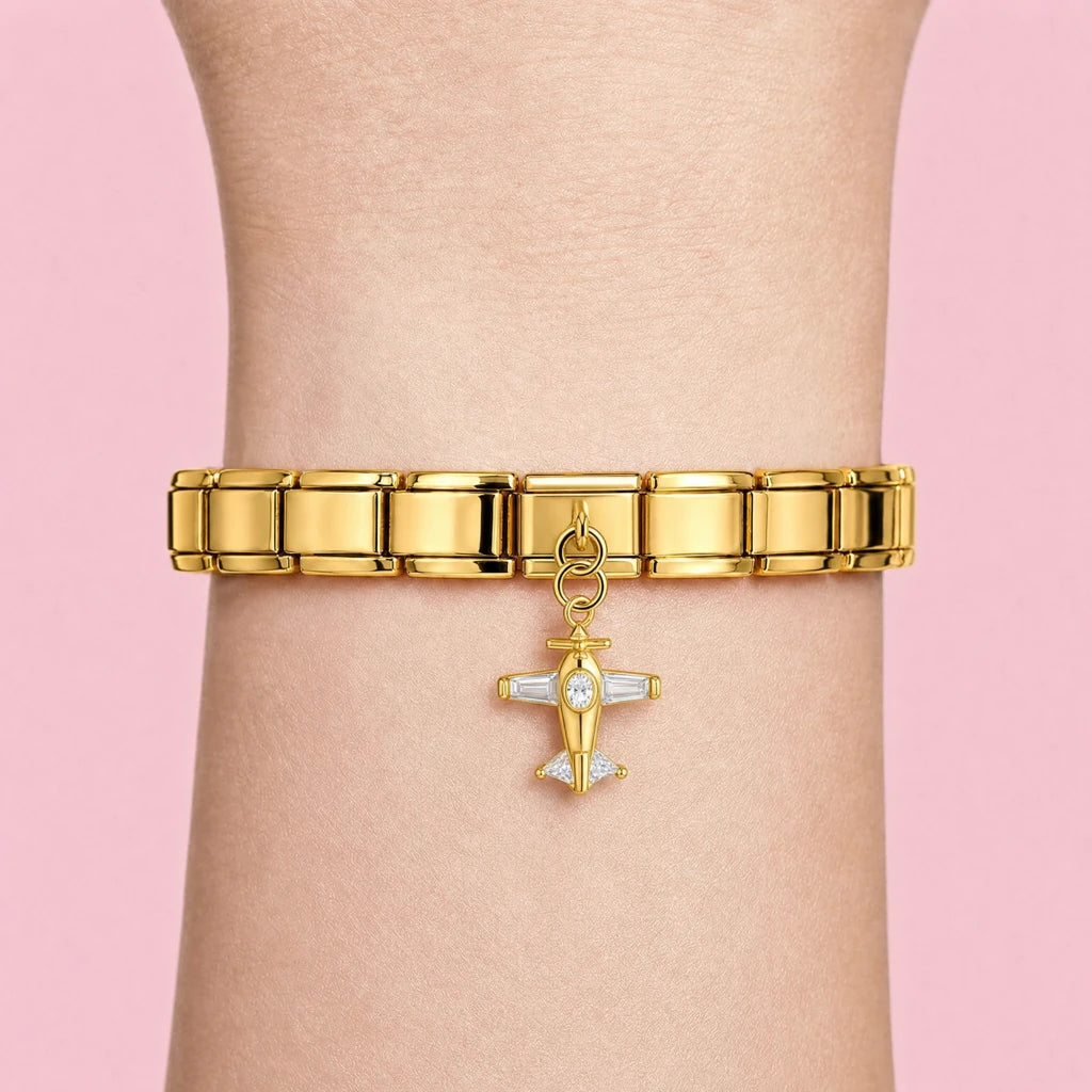 Crystal Plane charm worn on a gold Italian bracelet
