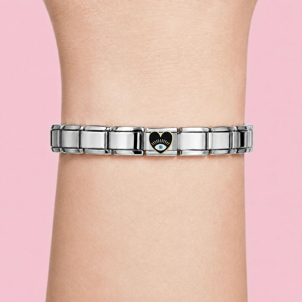 Black Eye Heart charm worn on a silver Italian bracelet