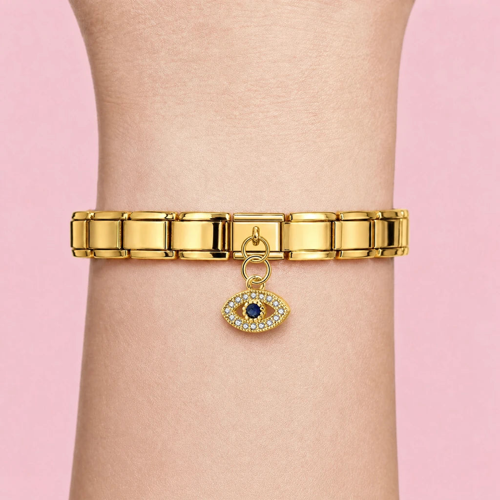 Golden Crystal Eye charm worn on a gold Italian bracelet
