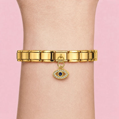 Golden Crystal Eye charm worn on a gold Italian bracelet