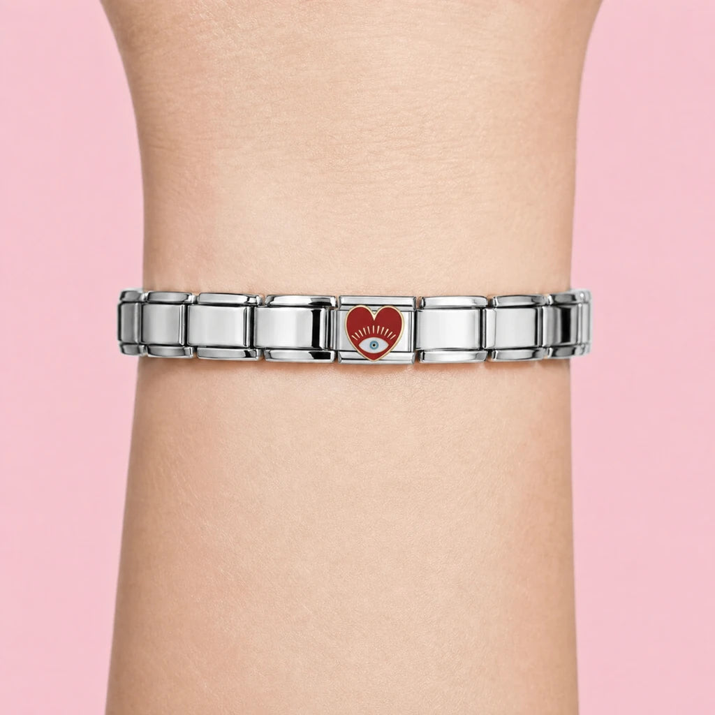 Red Eye Heart charm worn on a silver Italian bracelet