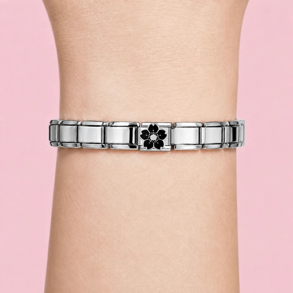 Black Sakura charm worn on a silver Italian bracelet