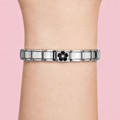 Black Sakura charm worn on a silver Italian bracelet