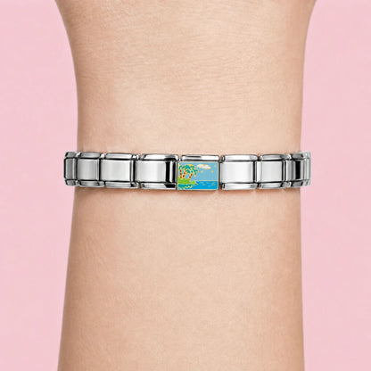 Beach Escape charm worn on a silver Italian bracelet