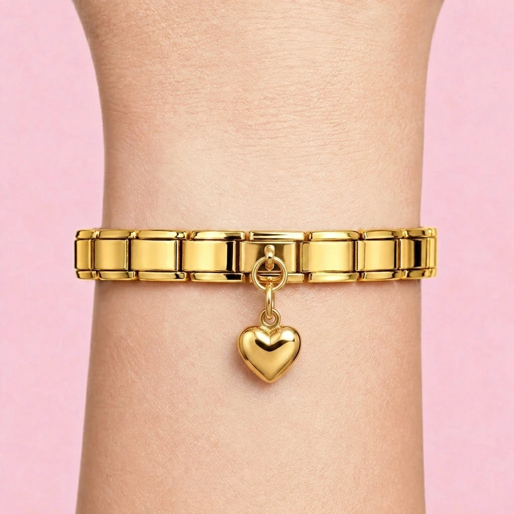 Heart dangle charm worn on a gold Italian bracelet