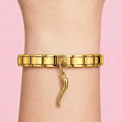 Italian horn dangle charm worn on a gold Italian bracelet