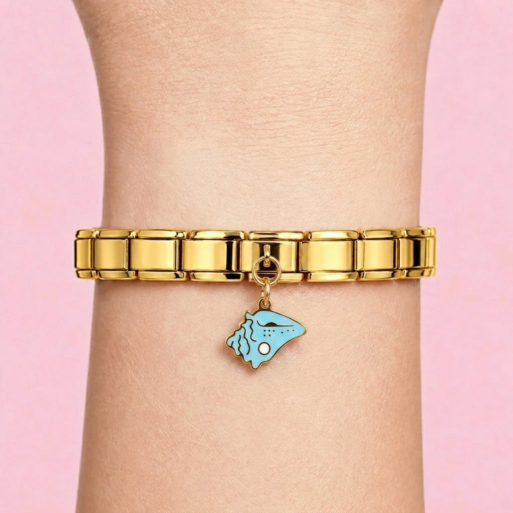 Manta ray dangle charm worn on a gold Italian bracelet