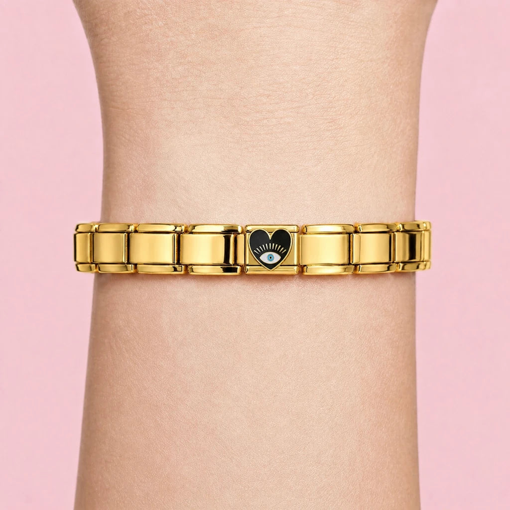 Black Heart charm worn on a gold Italian bracelet