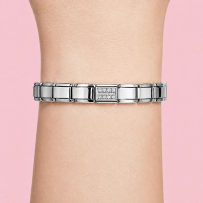 Clear Pavé charm worn on a silver Italian bracelet