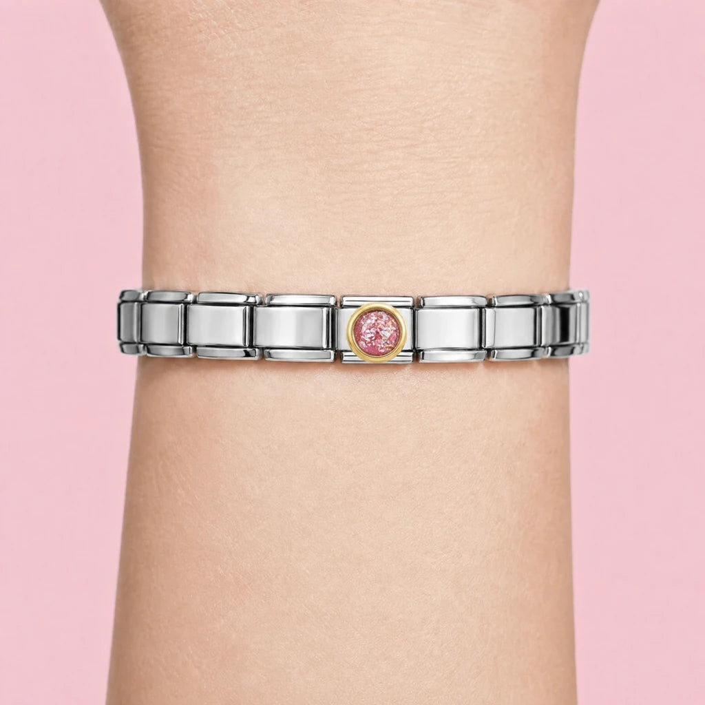 Pink Stardust charm worn on a silver Italian bracelet