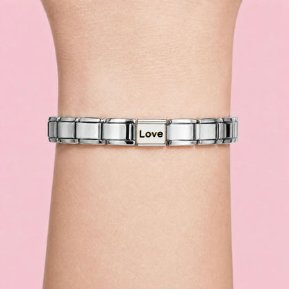 Love charm worn on a silver Italian bracelet