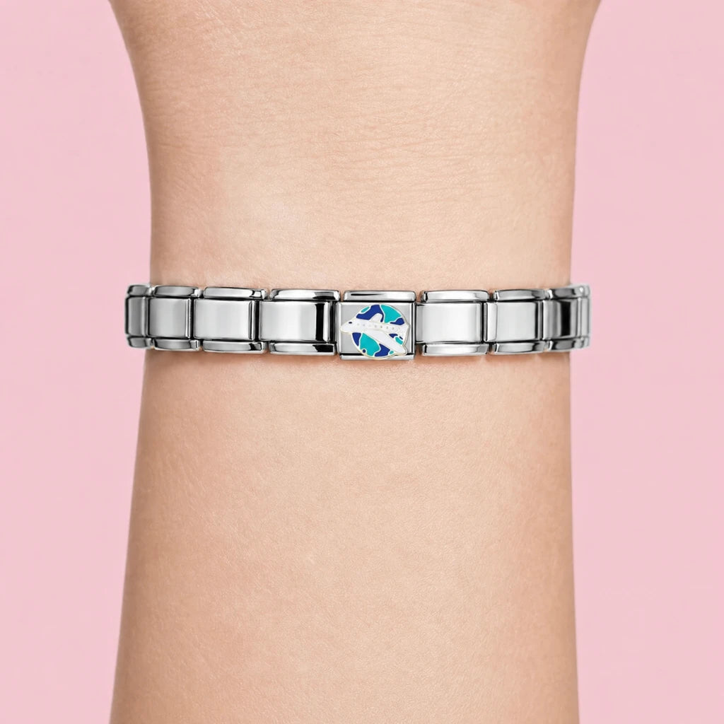 Airplane charm worn on a silver Italian bracelet