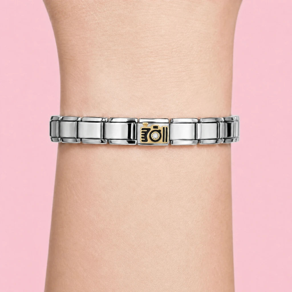 Golden Camera charm worn on a silver Italian bracelet