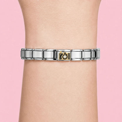 Golden Camera charm worn on a silver Italian bracelet
