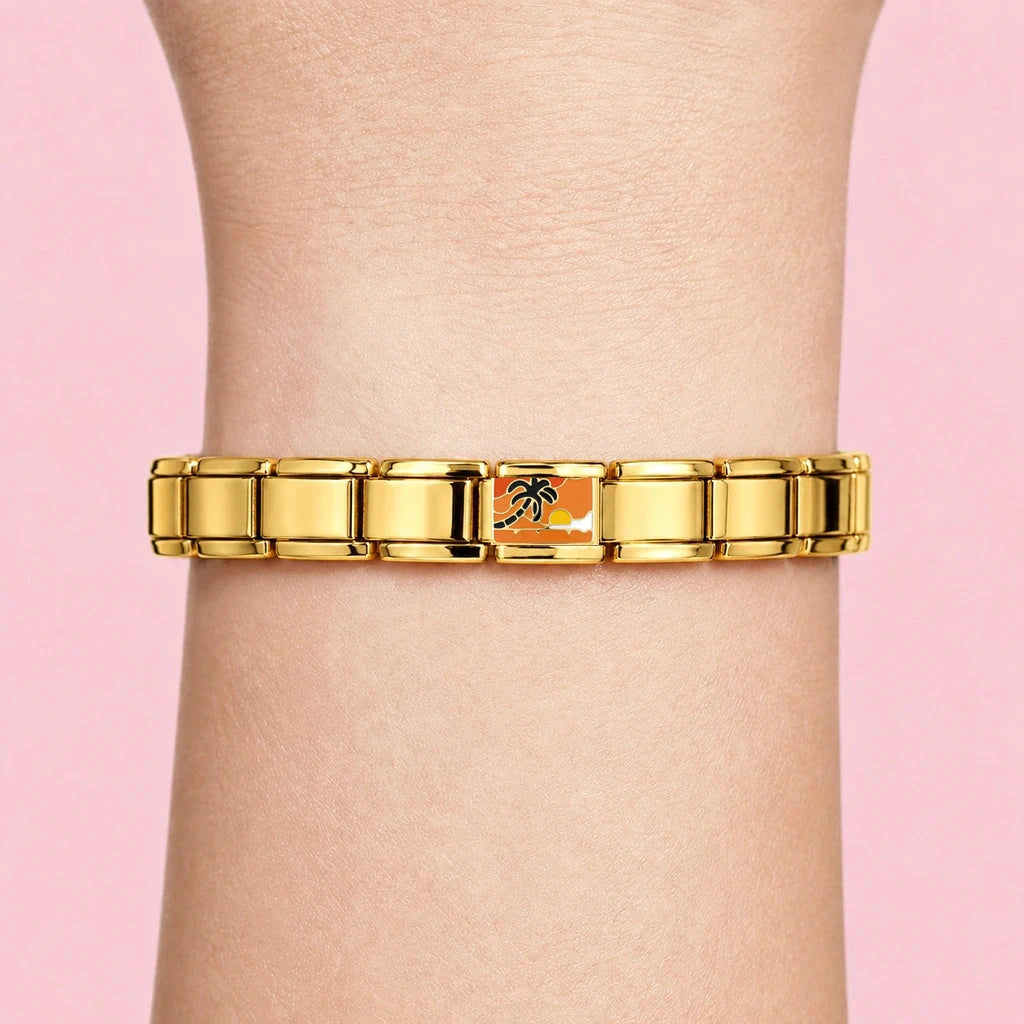 Palm Sunset charm worn on a gold Italian bracelet