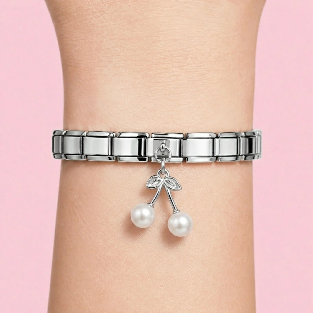 Pearl cherry dangle charm worn on a silver Italian bracelet