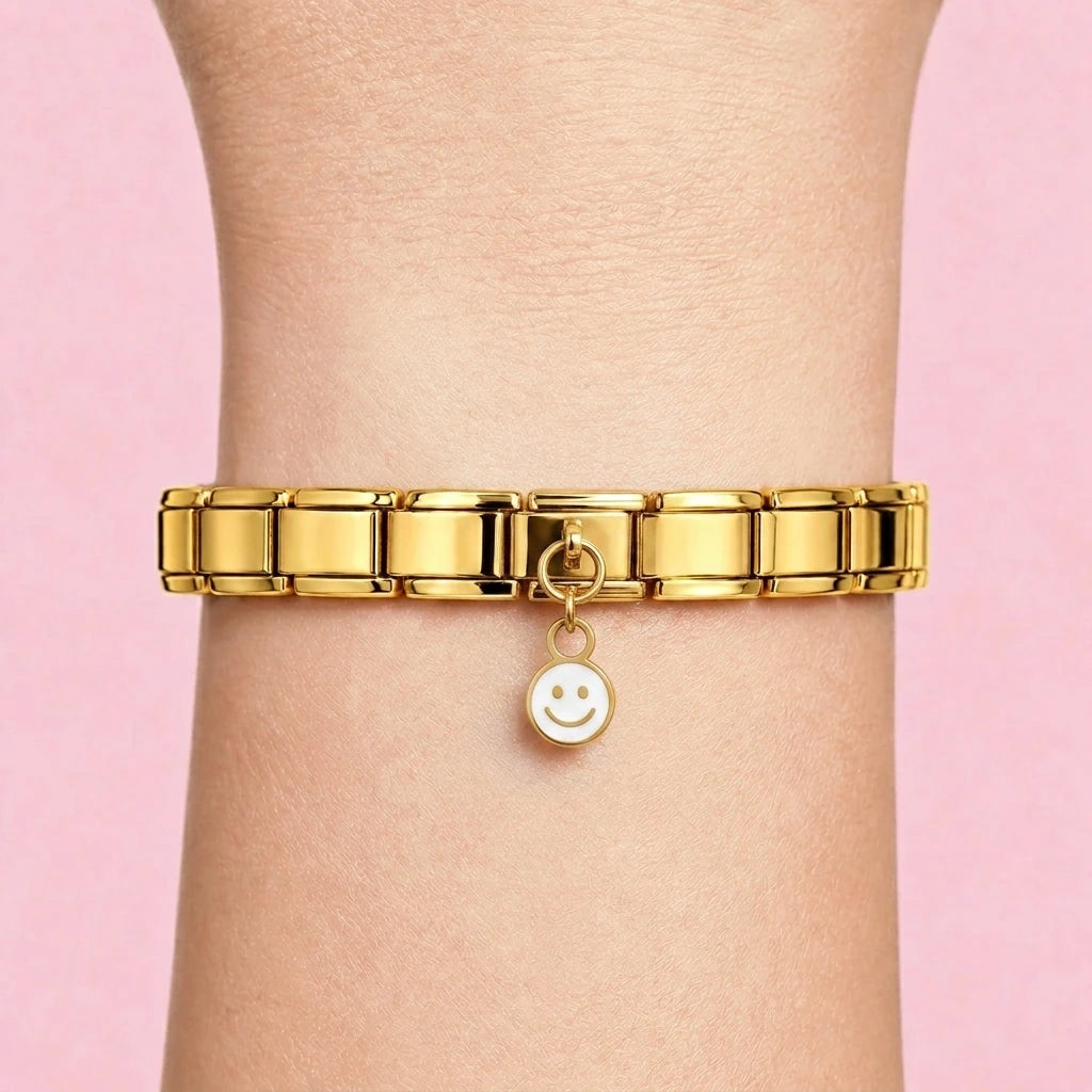 Smiley dangle charm worn on a gold Italian bracelet