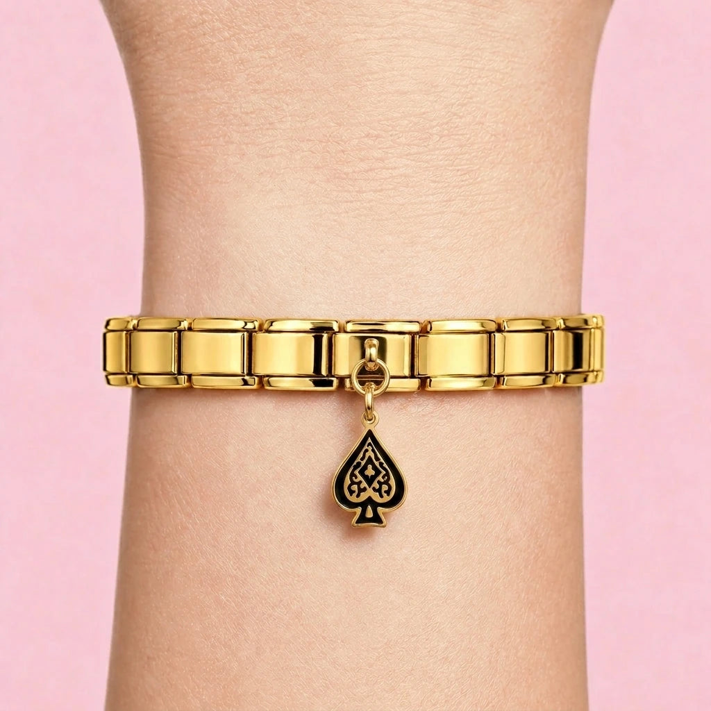 Spade dangle charm worn on a gold Italian bracelet