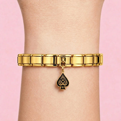 Spade dangle charm worn on a gold Italian bracelet