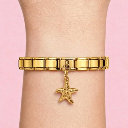 Starfish dangle charm worn on a gold Italian bracelet