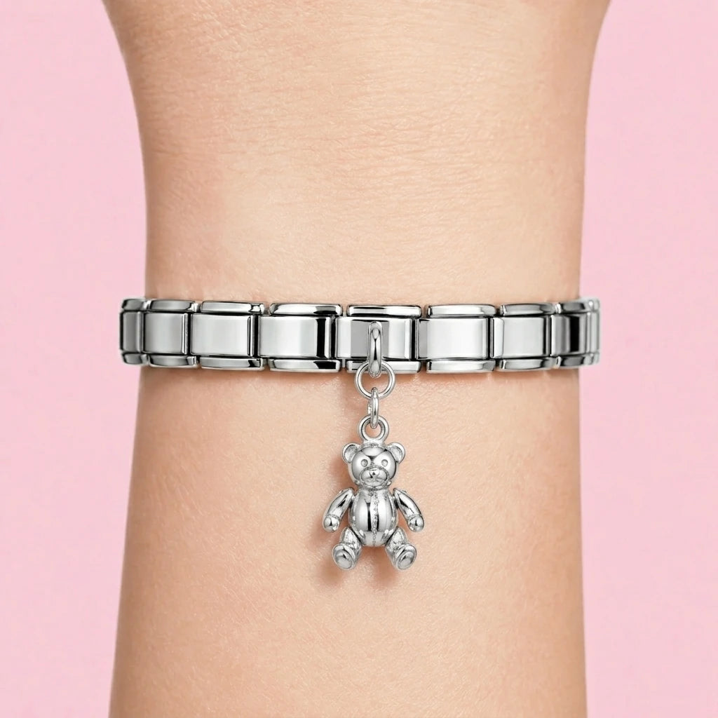 Teddy bear dangle charm worn on a silver Italian bracelet