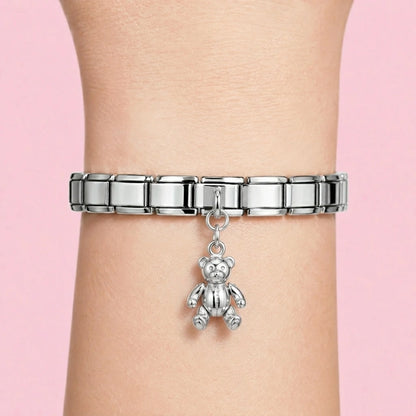 Teddy bear dangle charm worn on a silver Italian bracelet