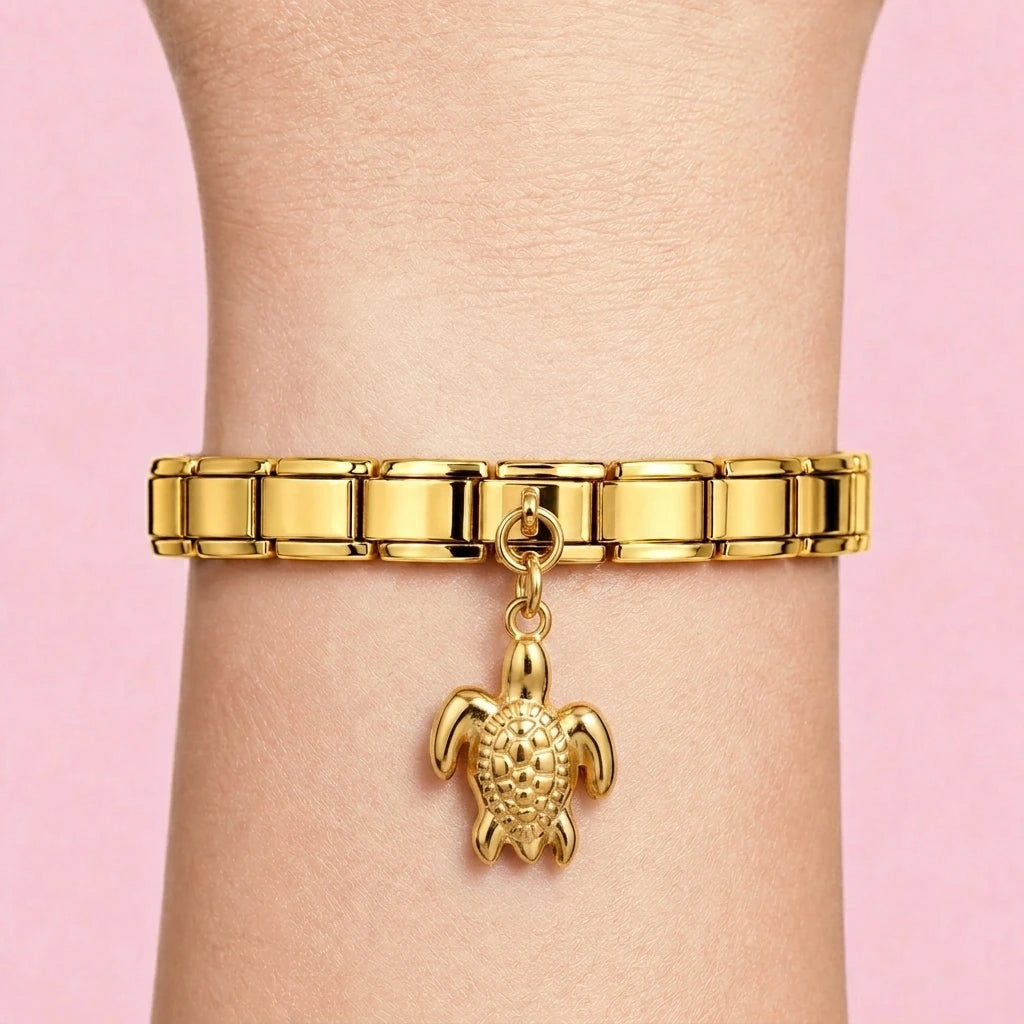 Turtle dangle charm worn on a gold Italian bracelet