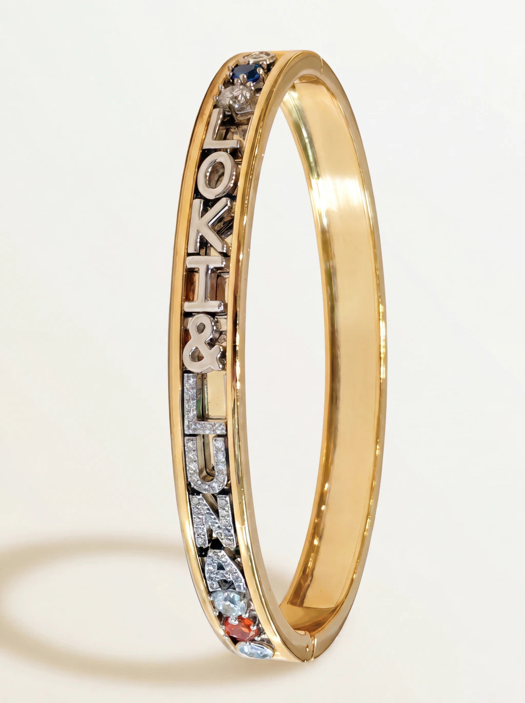 Charm bangle — gold