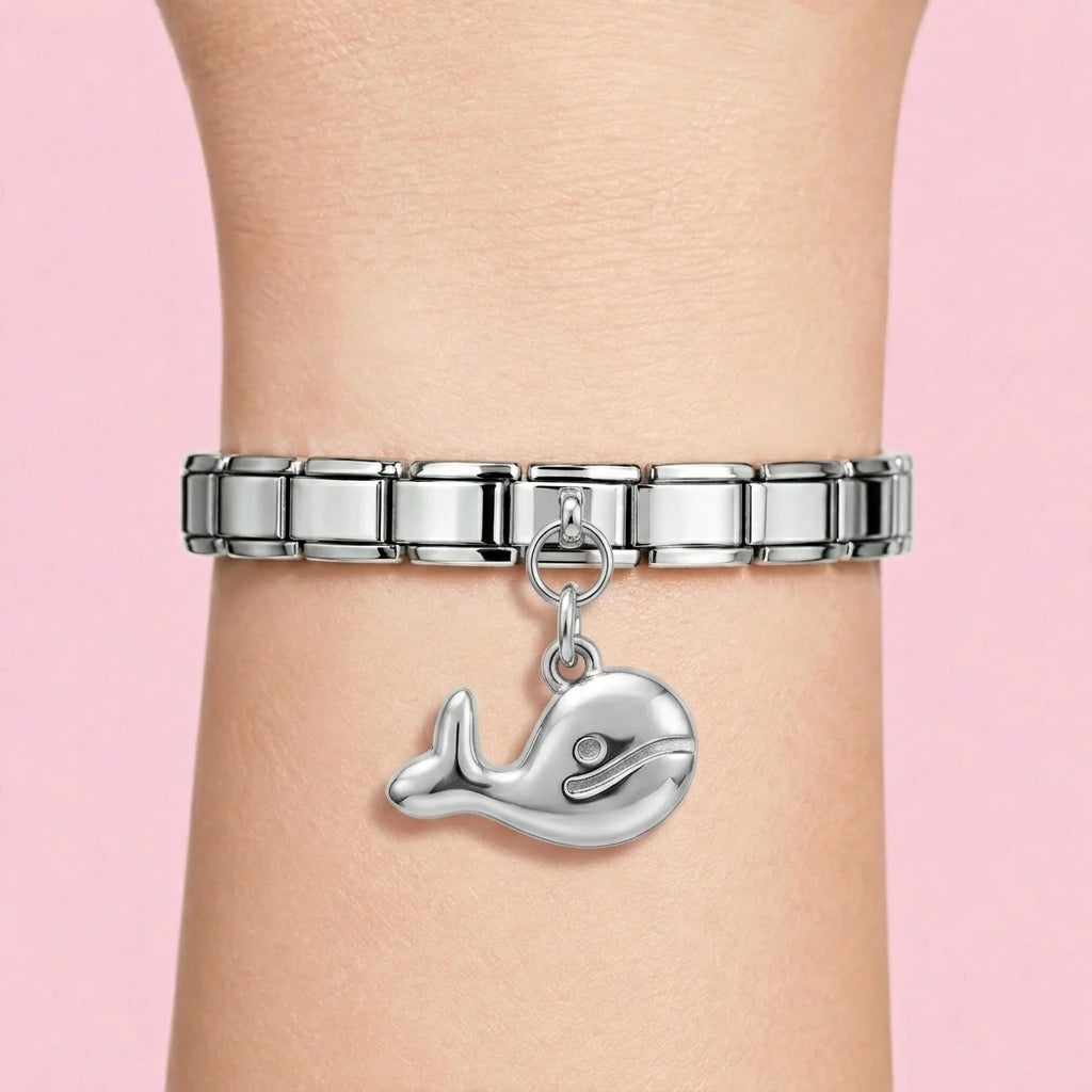 Whale dangle charm worn on a silver Italian bracelet