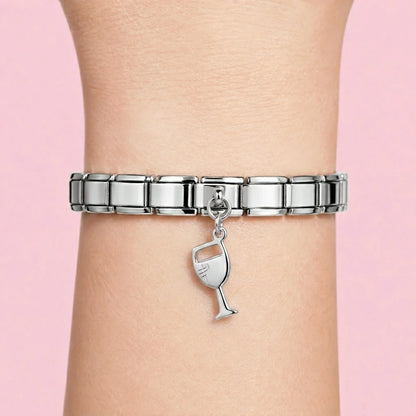 Wine glass dangle charm worn on a silver Italian bracelet